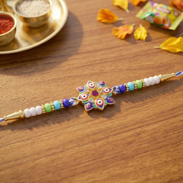 Evil Eye OM Star Rakhi displayed on a traditional thali for Raksha Bandhan.