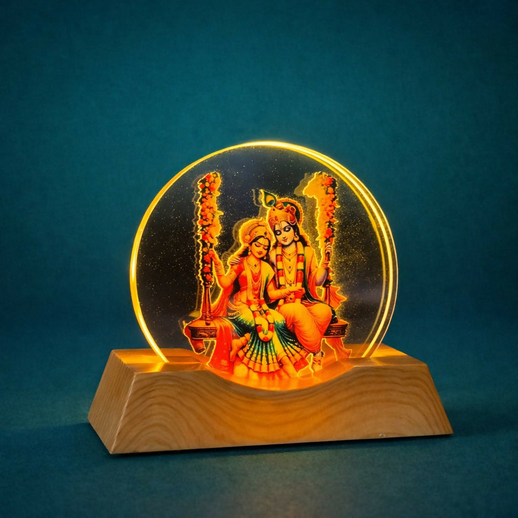 Radha Krishna lamp glowing in dim meditation room