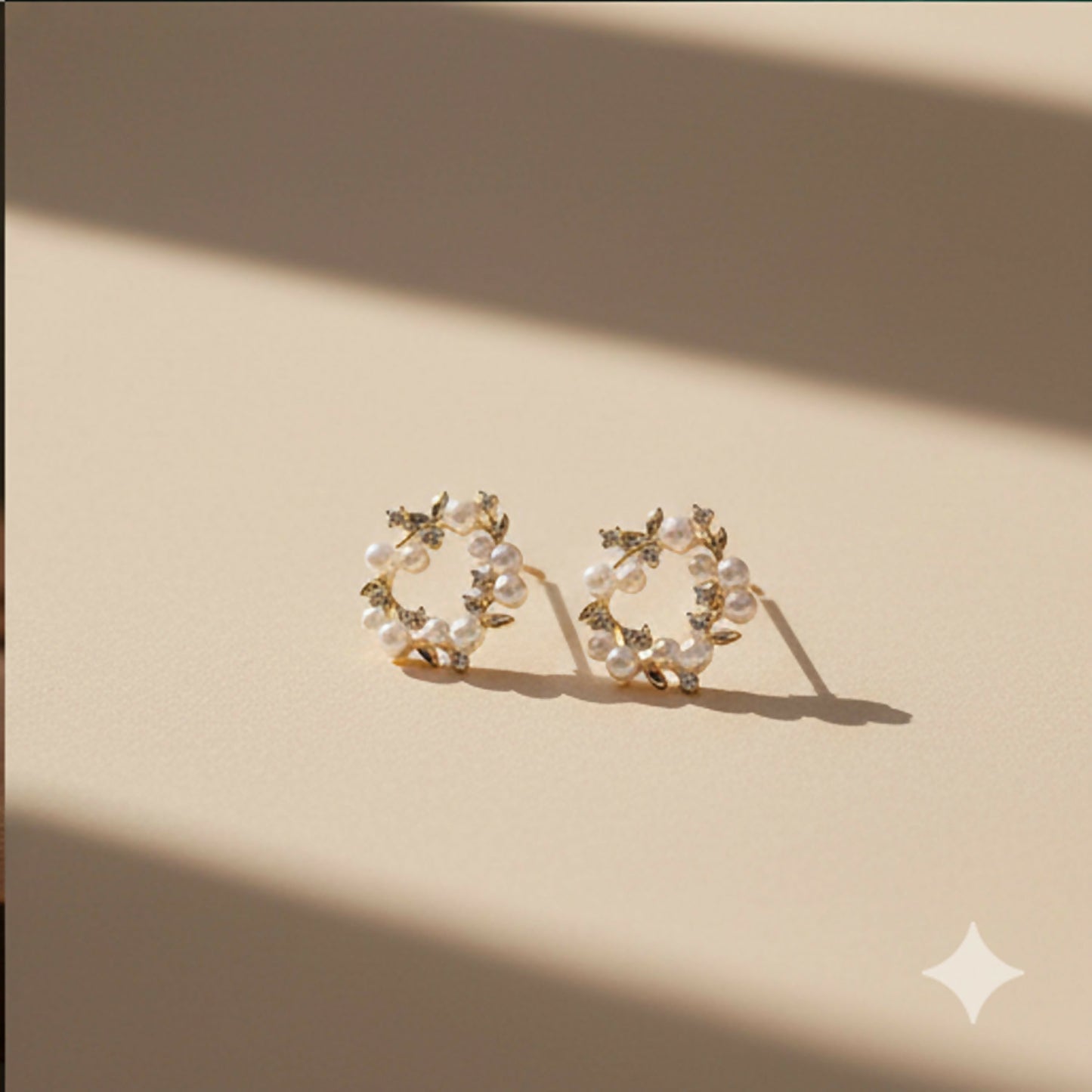 Pearl wreath stud earrings worn on ear, elegant look