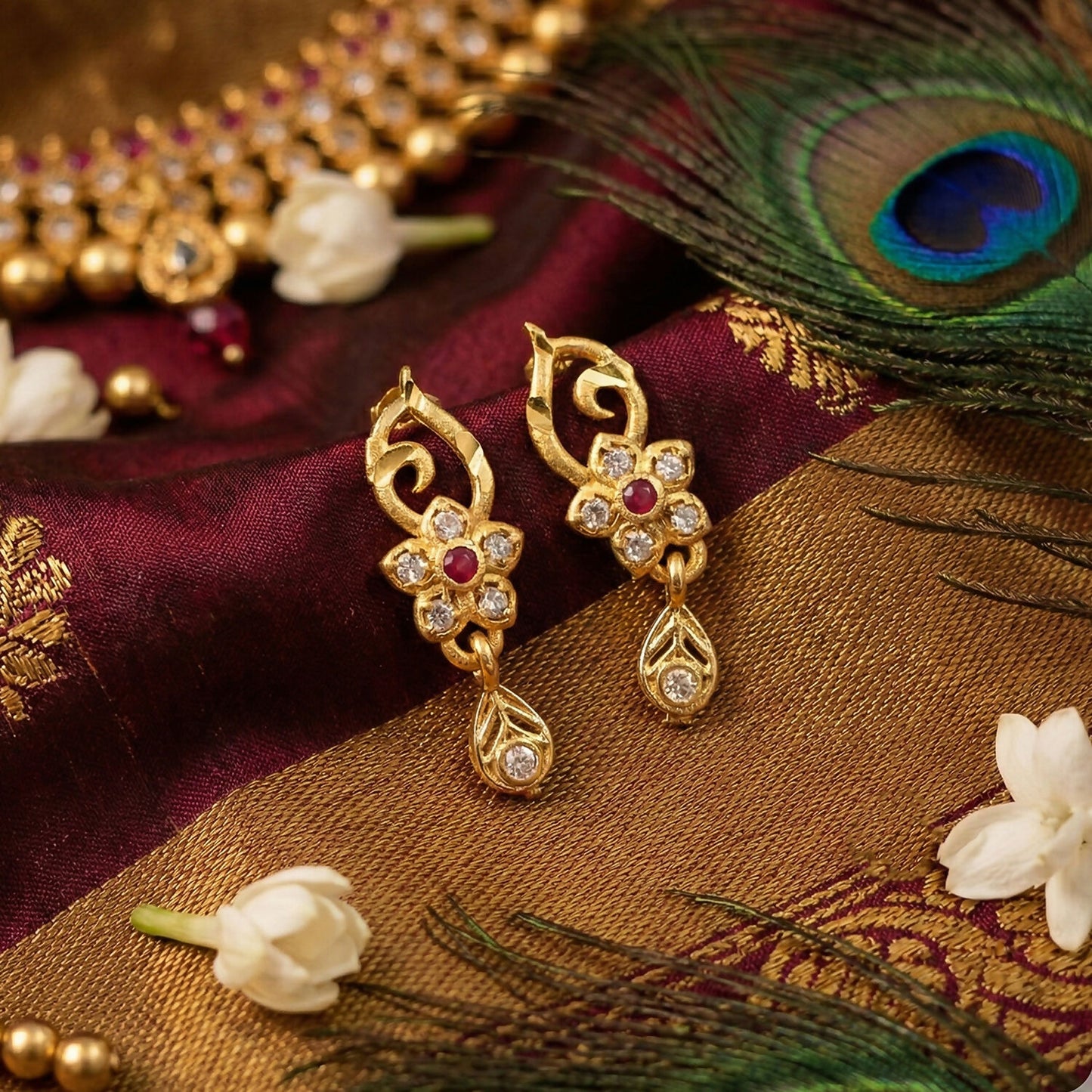 Traditional Floral Gold Earrings With Ruby Center Stone And Leaf Shaped Drop Detail