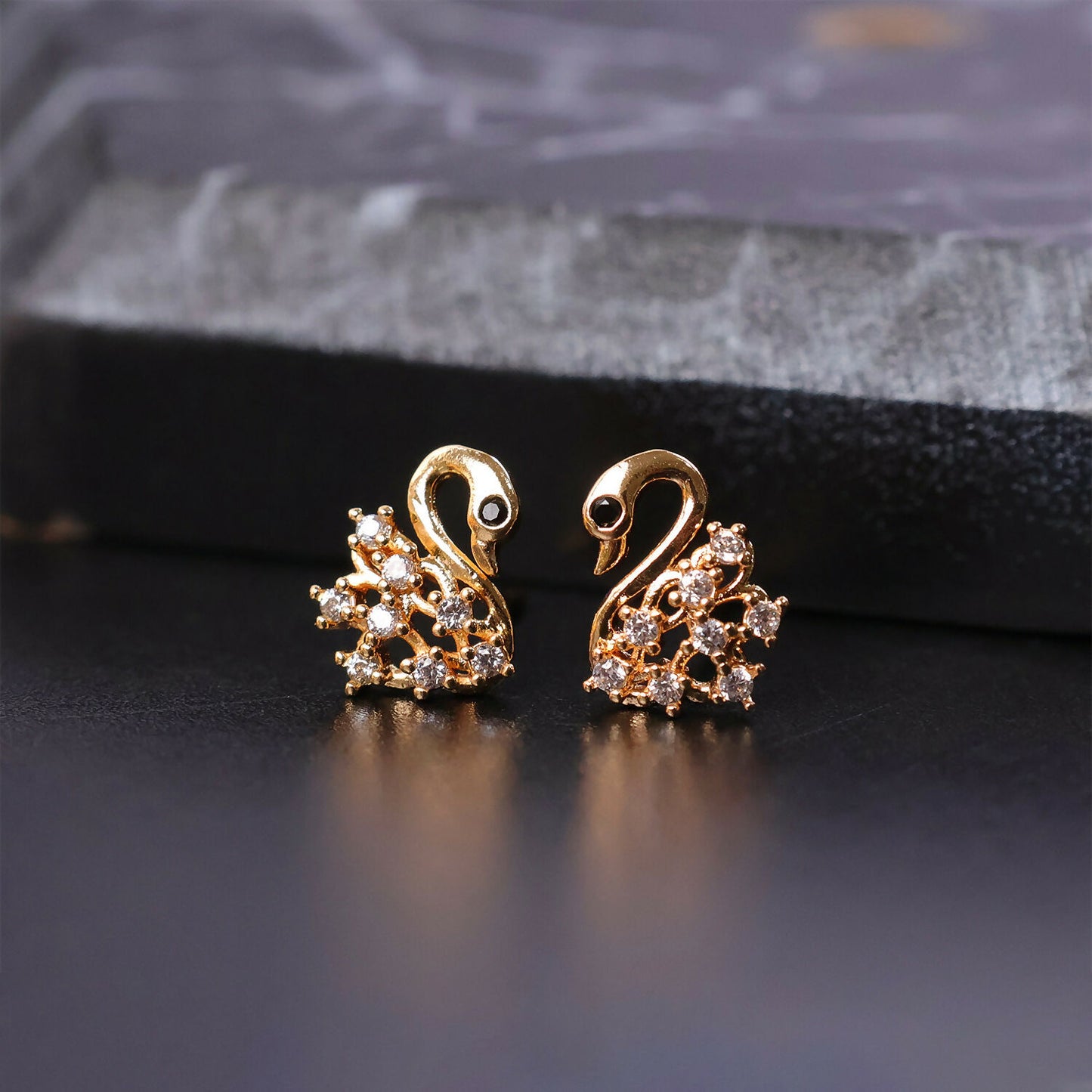 Elegant swan shaped earrings with cubic zirconia stones, perfect for gifting