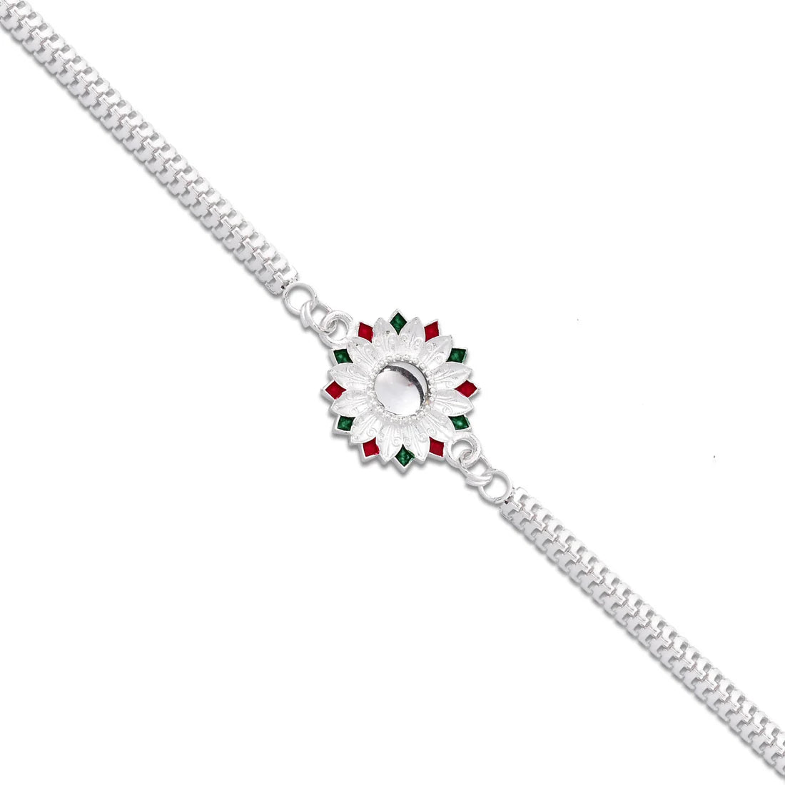 Silver Meenakari Rakhi displayed with roli chawal for Raksha Bandhan rituals.