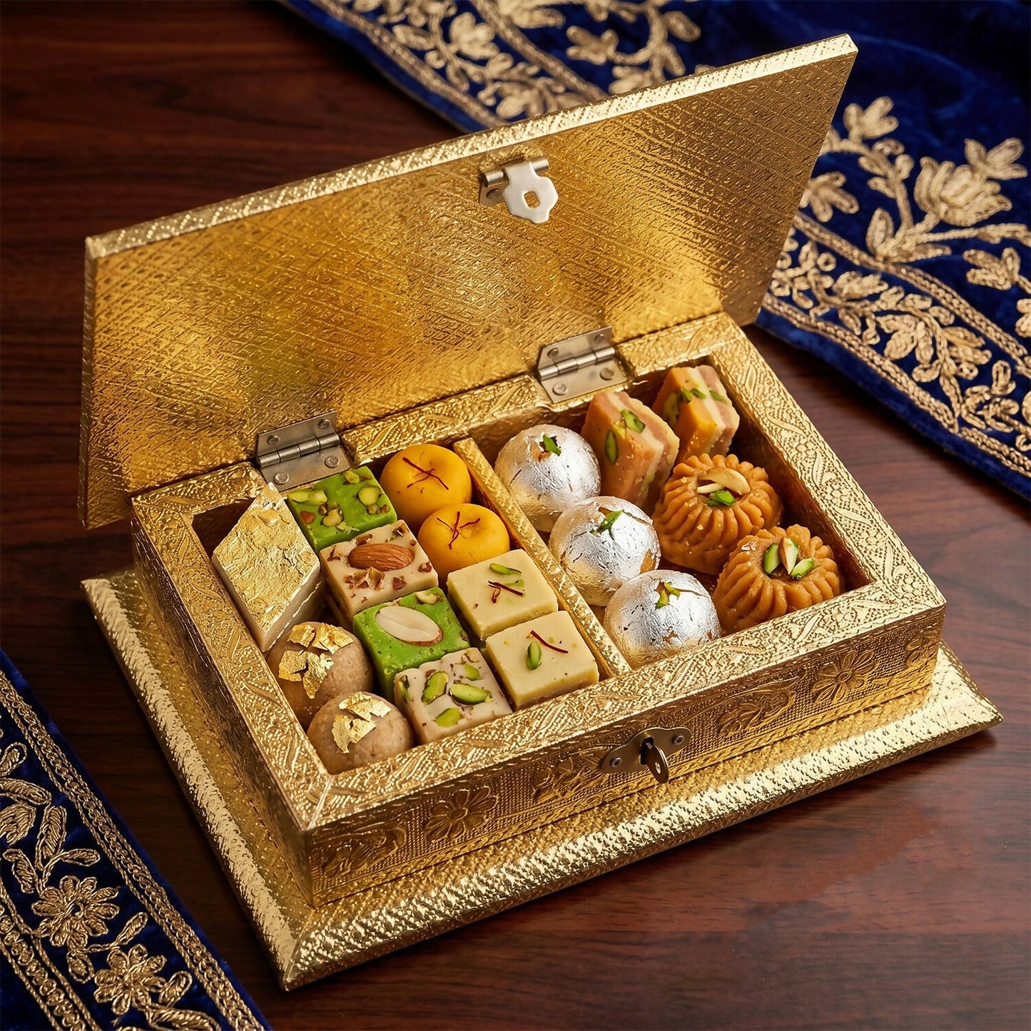 Detailed close-up of floral embossing on golden metal jewelry box