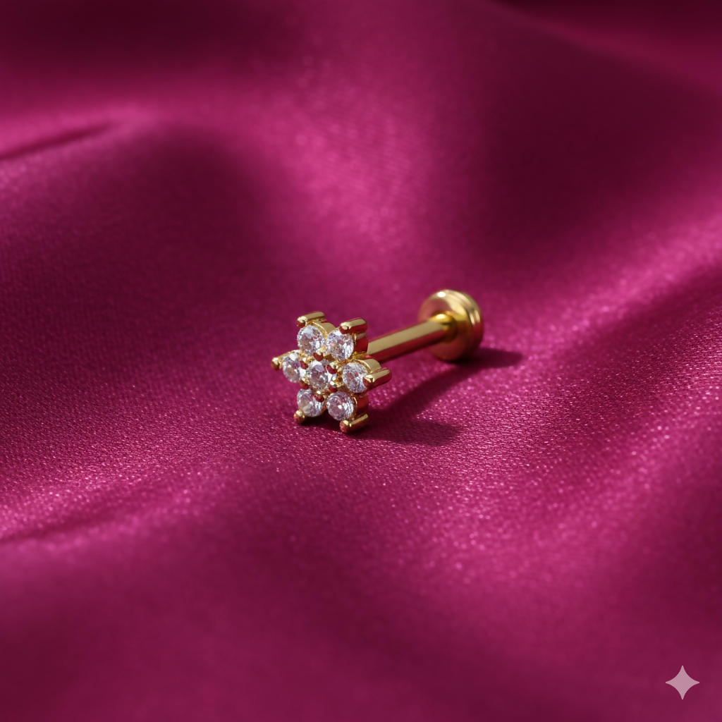 Close-up of gold plated crystal flower flat back nosepin showing seven sparkling crystals