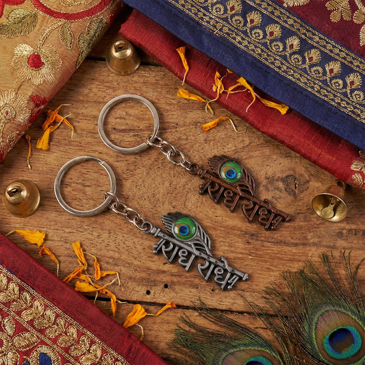 Radhe Radhe Metal Keychain with Peacock Feather Design – Divine Copper Finish (Mix Color) (1 Pc)