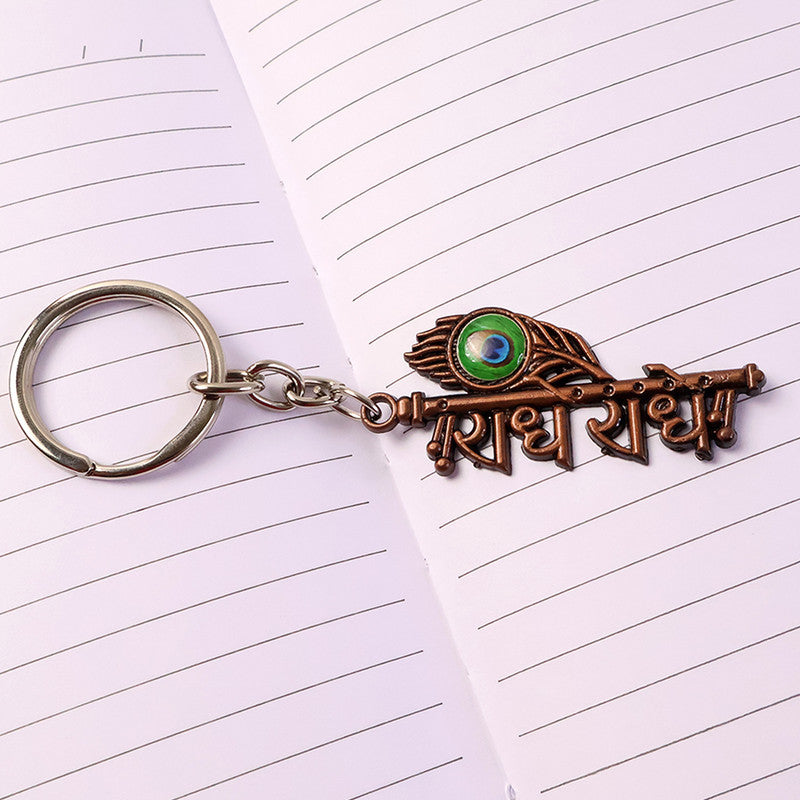 Radhe Radhe Metal Keychain with Peacock Feather Design – Divine Copper Finish (Mix Color) (1 Pc)