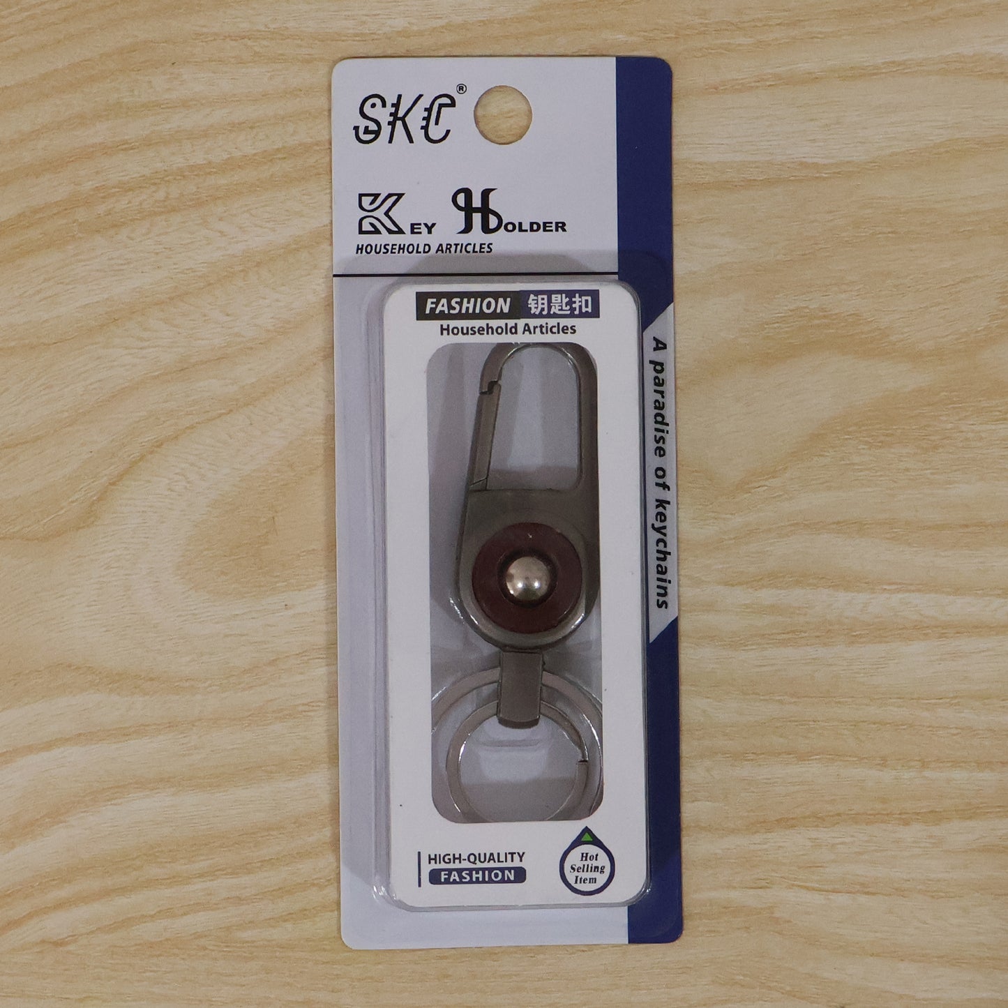 Compact metal key holder featuring locking carabiner clip in outdoor setting