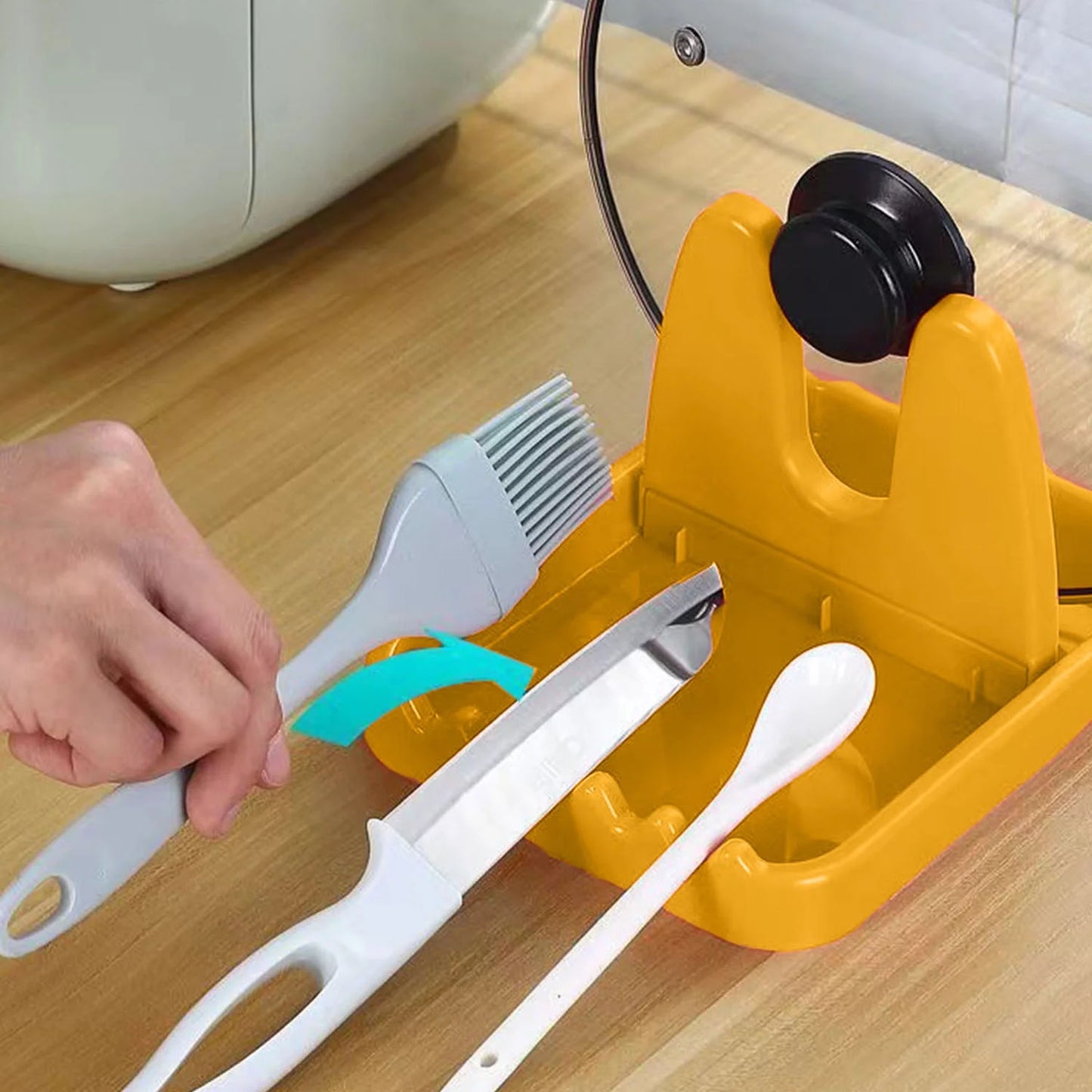 Spatula placed in holder stand in kitchen