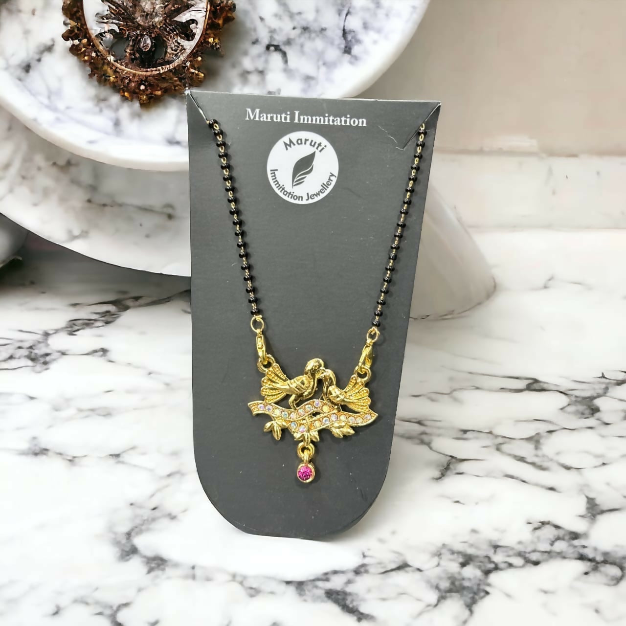 Gold-Toned Bird Design Mangalsutra with Stone-Studded Pendant and Pink Drop