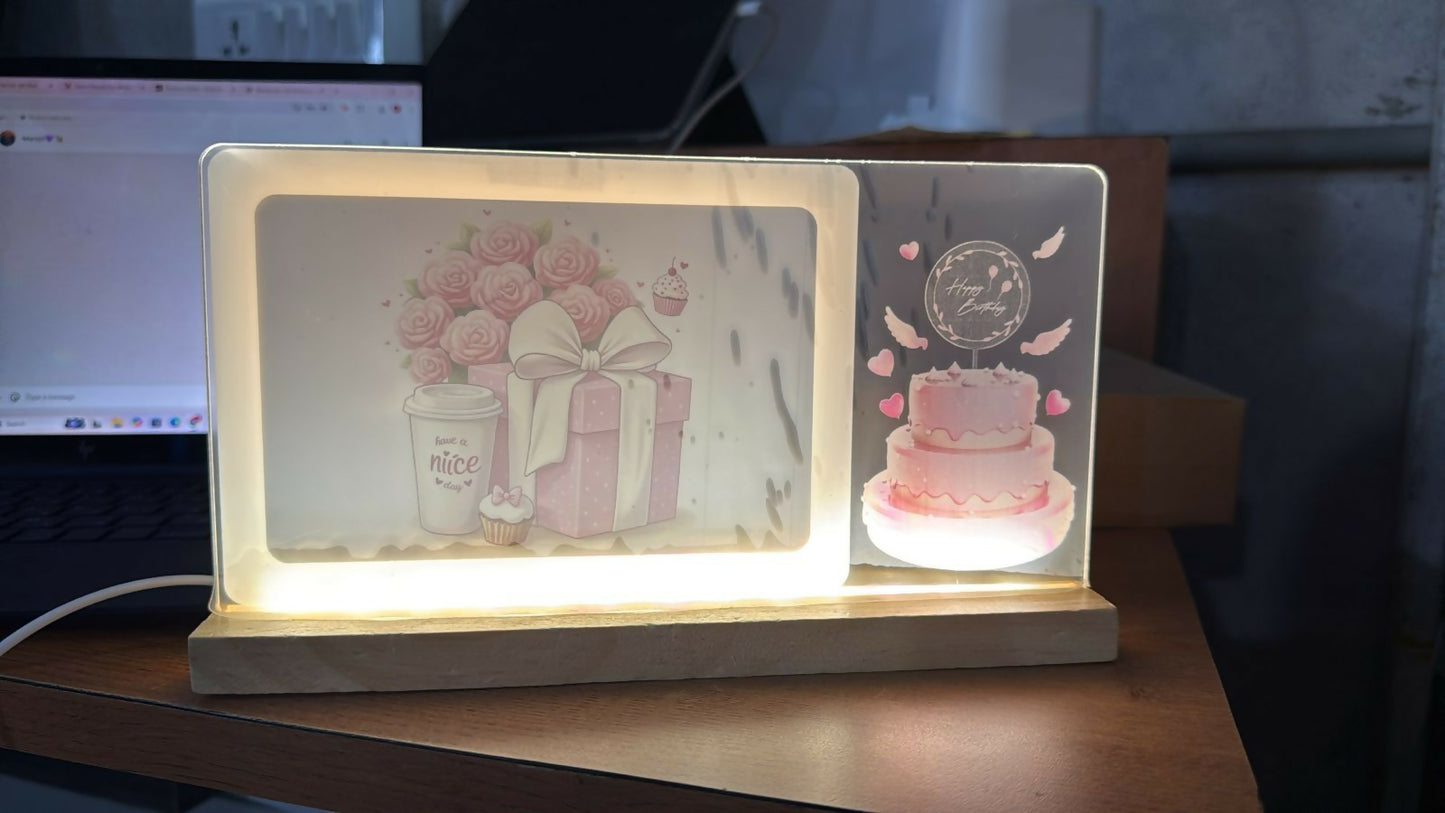 LED birthday photo frame lamp lit up on wooden desk