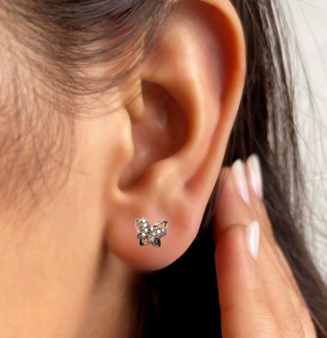 Delicate butterfly stud earrings in rose gold with micro-set cubic zirconia stones highlighting pave design