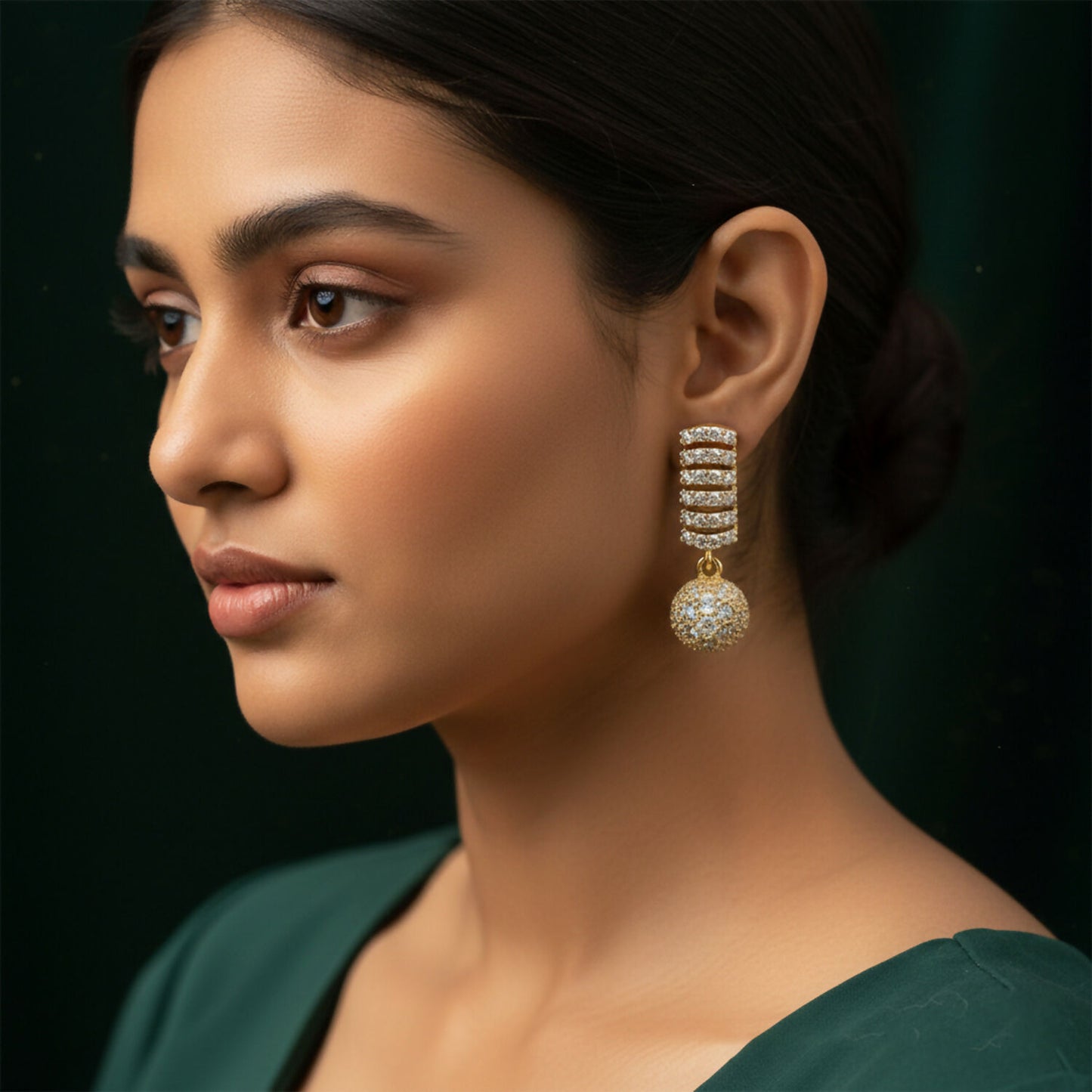 Detailed image of delicate hanging ball design on CZ studded drop earrings