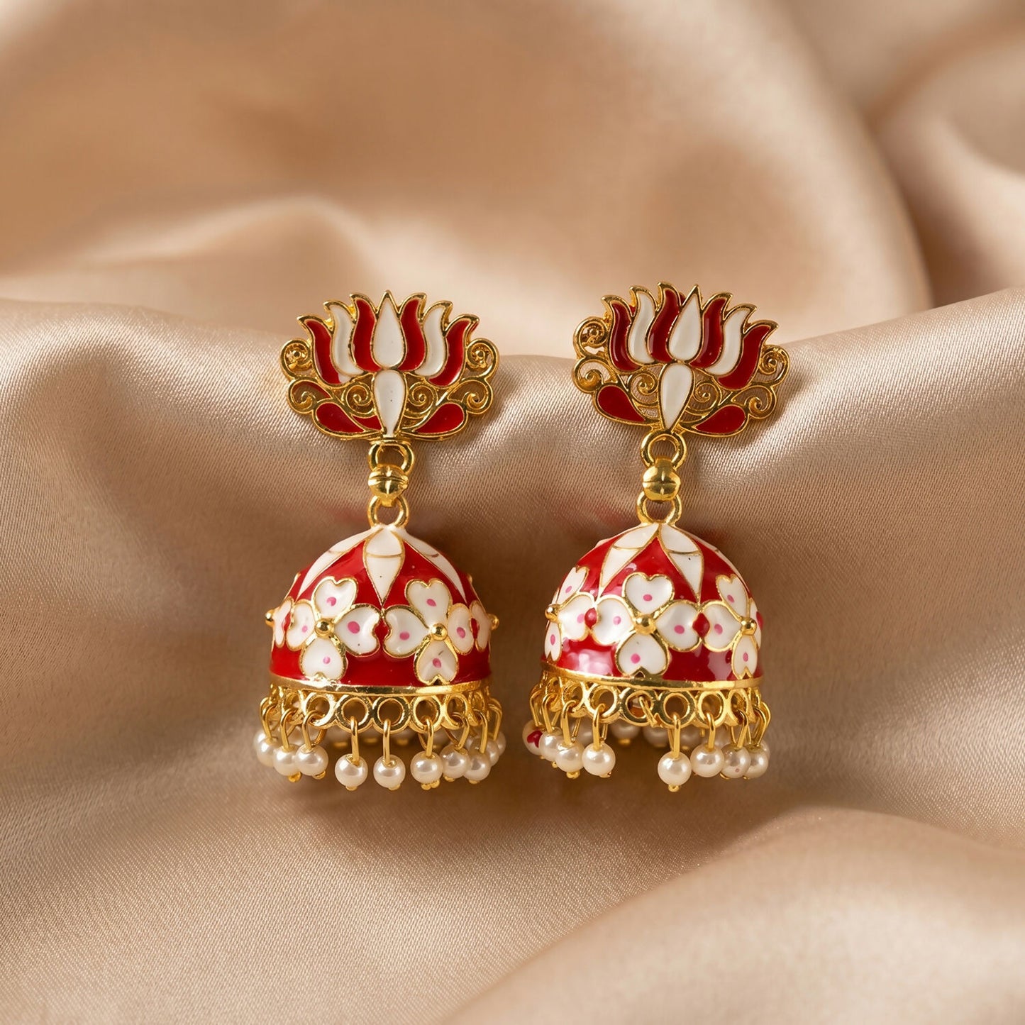 Red Lotus Jhumka Earrings set on white background