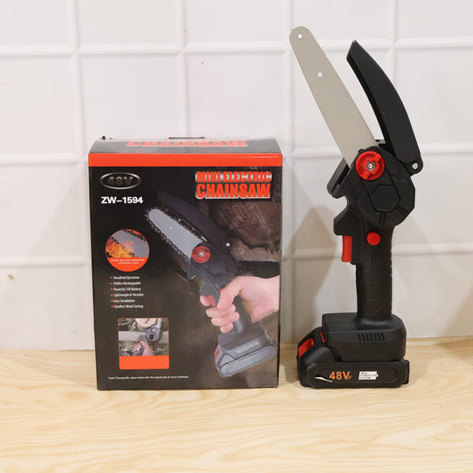 Person using mini cordless electric chainsaw to cut a tree branch
