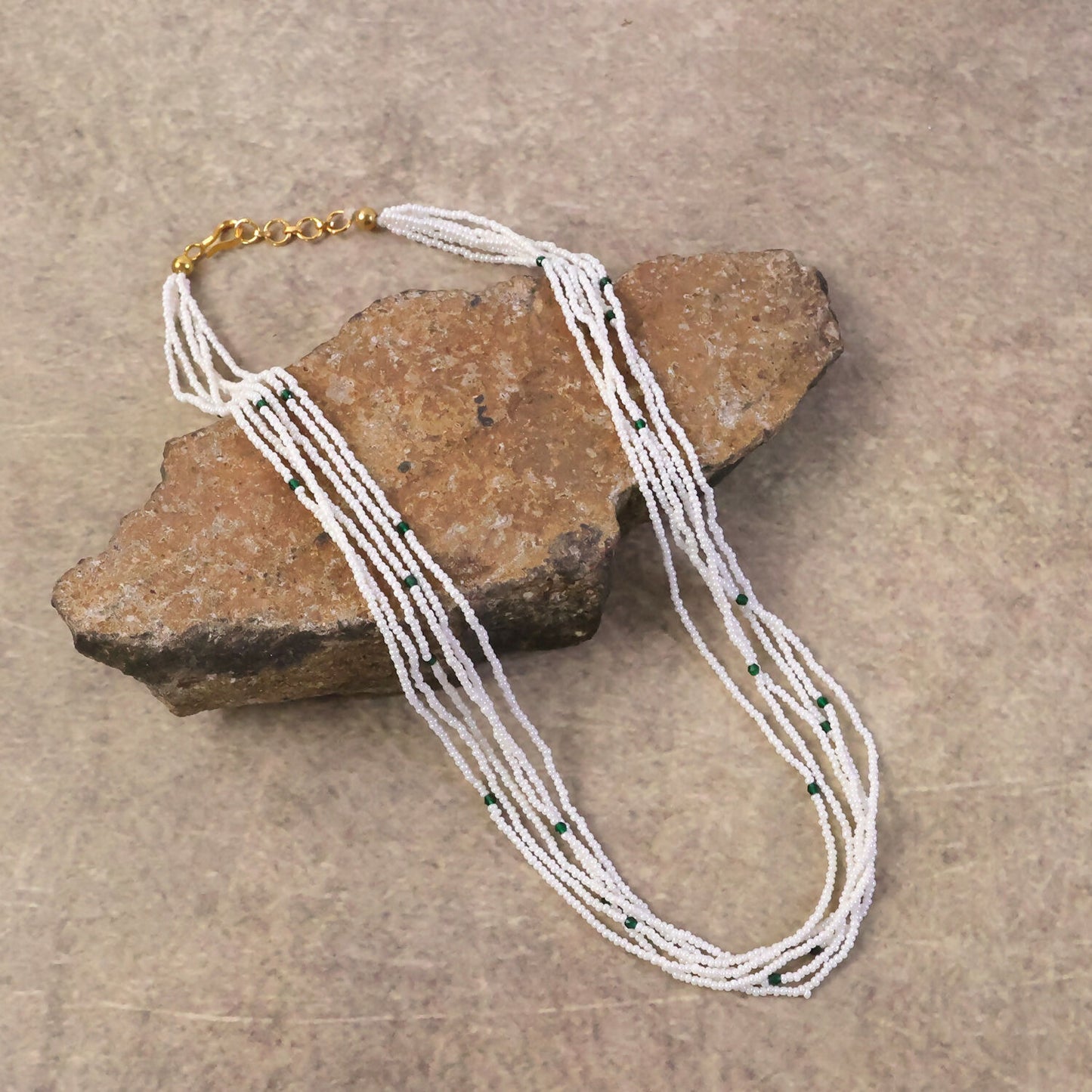 Close-up of pearl and contrasting beads on an ethnic necklace