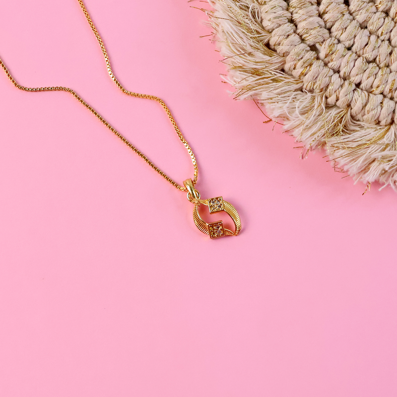 Detailed view of sparkling stones on curved pendant necklace twist design