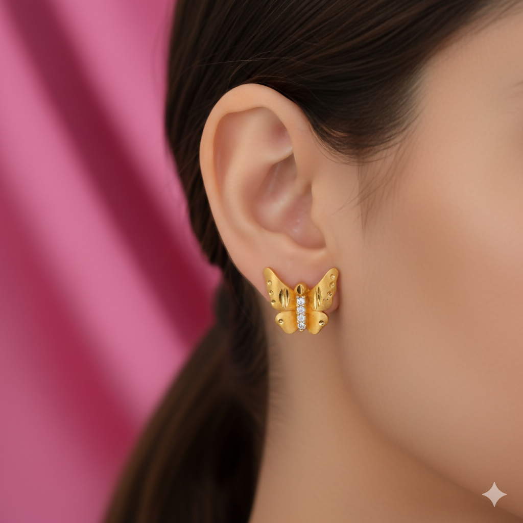Close-up view of gold butterfly studs with micro-pavé crystals for women and girls