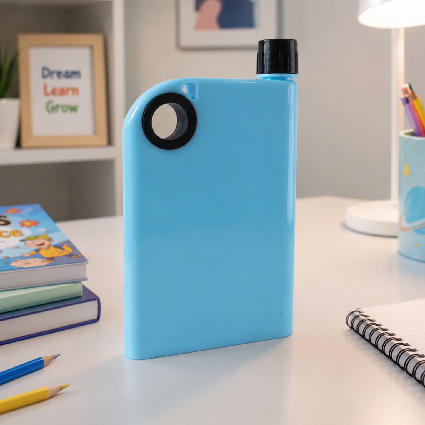 Blue slim water bottle easily slipping into bag
