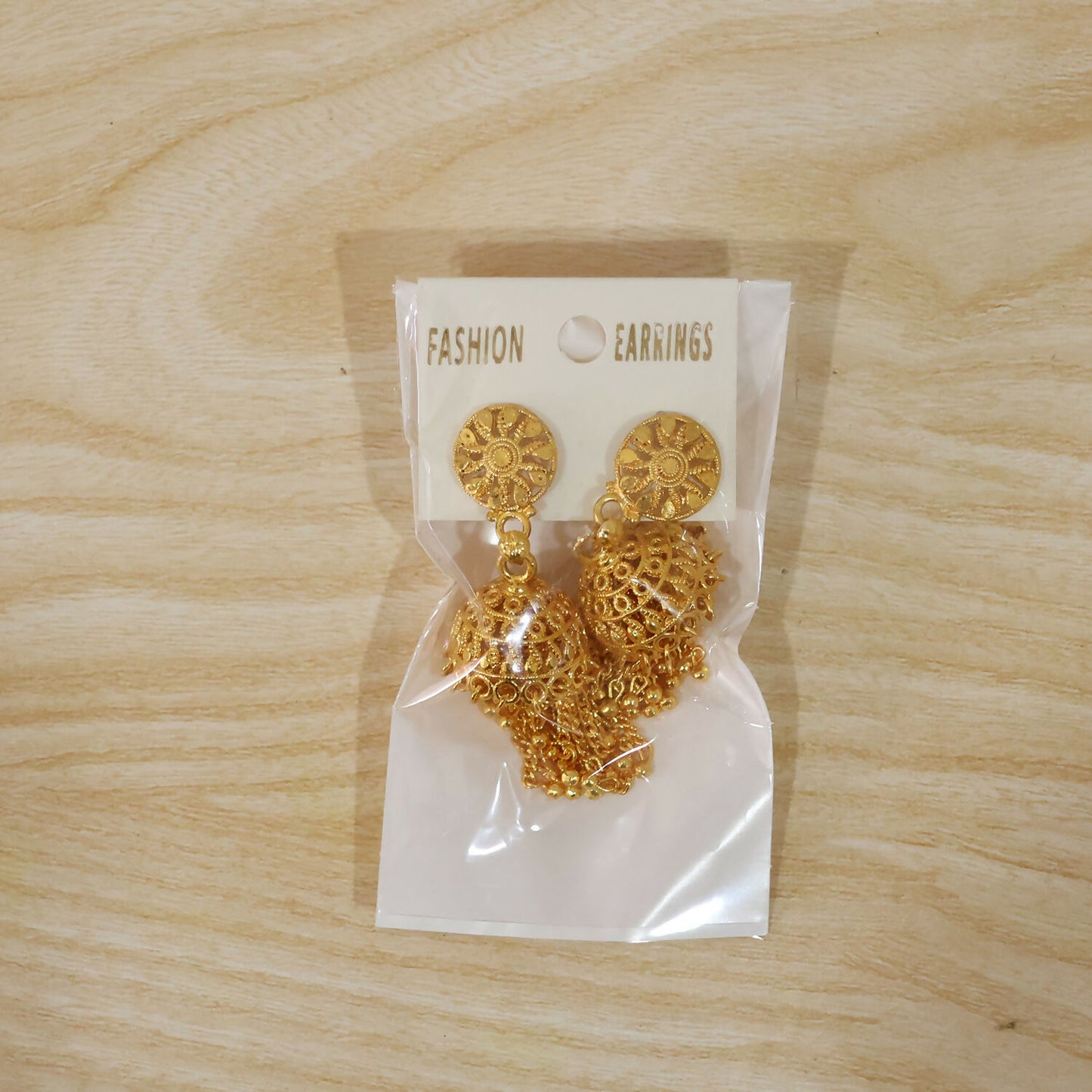 Golden Chain Tassel Jhumka Earrings worn on ear live look