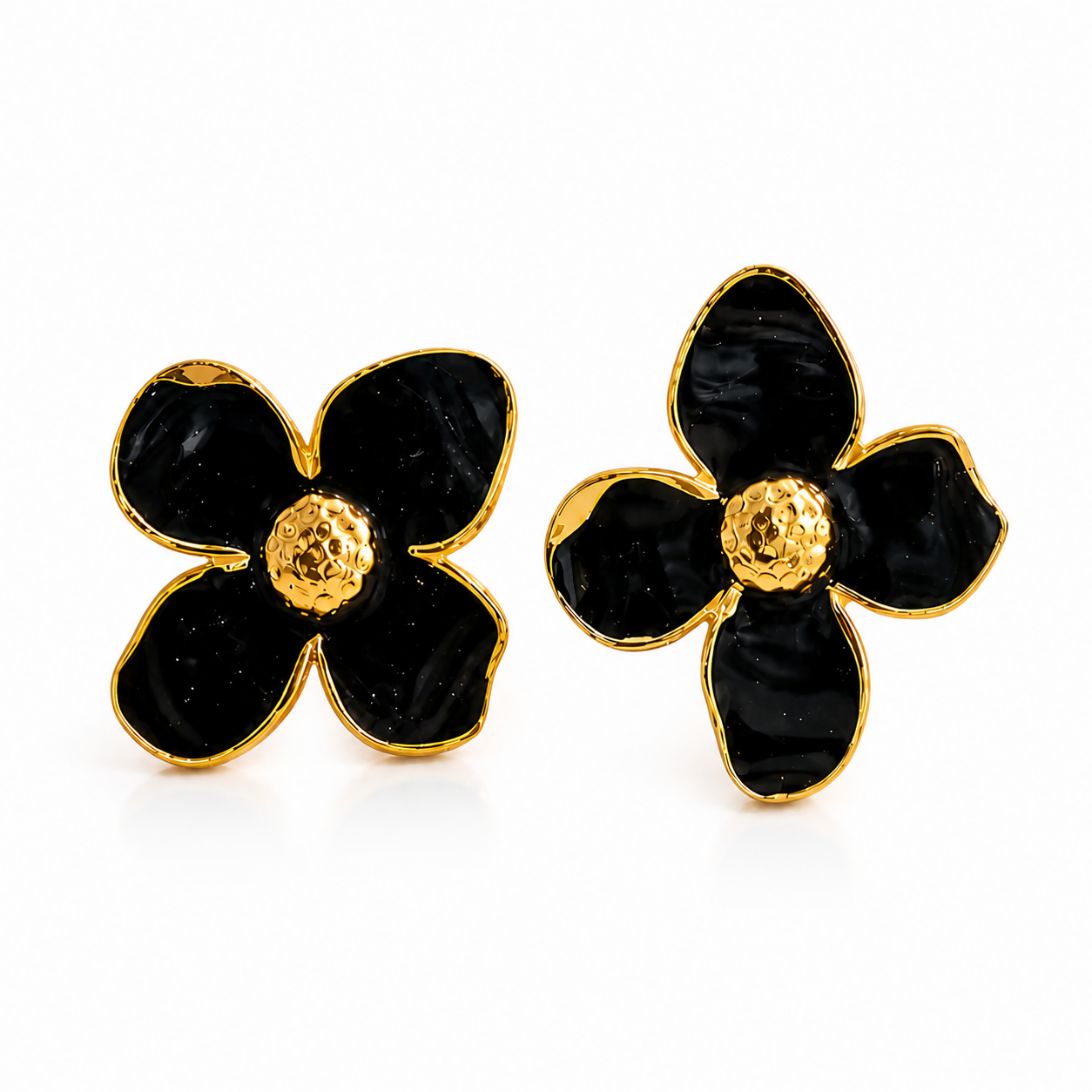 Close-up of black floral enamel design on earrings