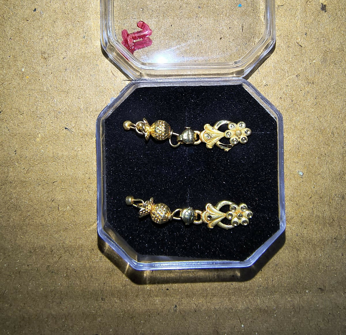 Packaged NG01B earrings in luxury velvet pouch