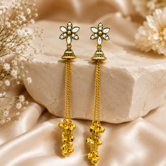 Elegant gold plated floral jhumka earrings with long chain tassels for women.