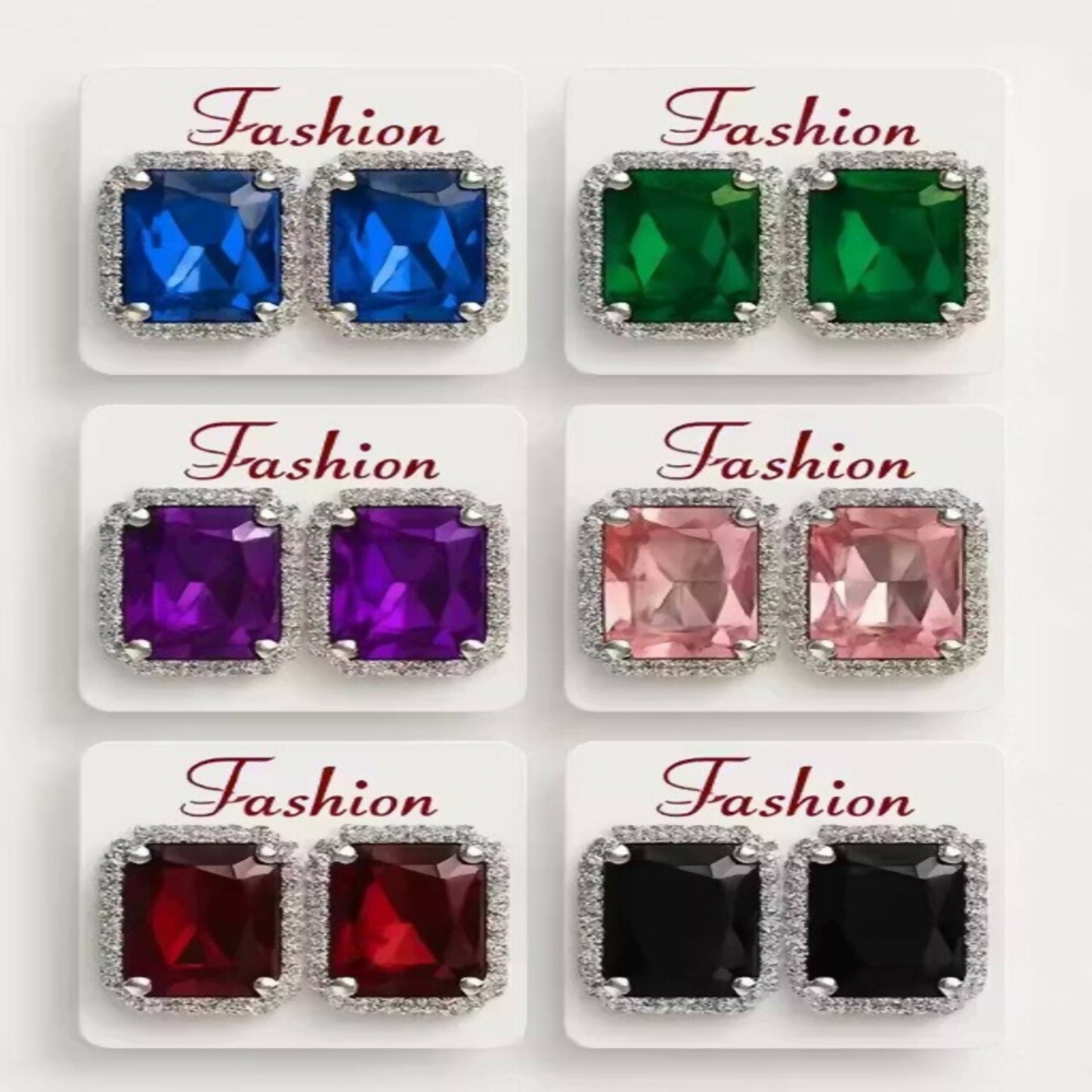 Close-up of a single purple emerald cut crystal stud earring with intricate silver filigree.
