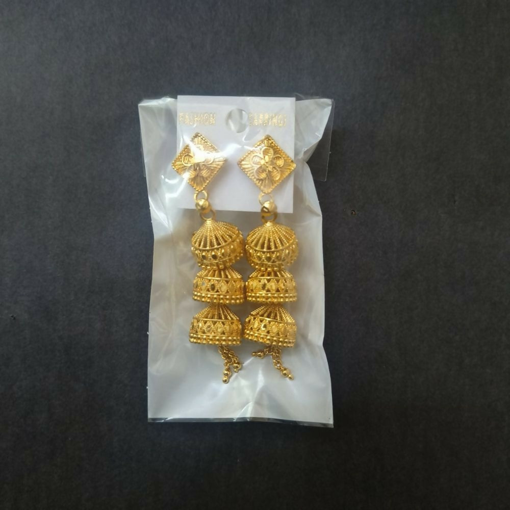 Gold jhumka earrings showcasing their traditional appeal