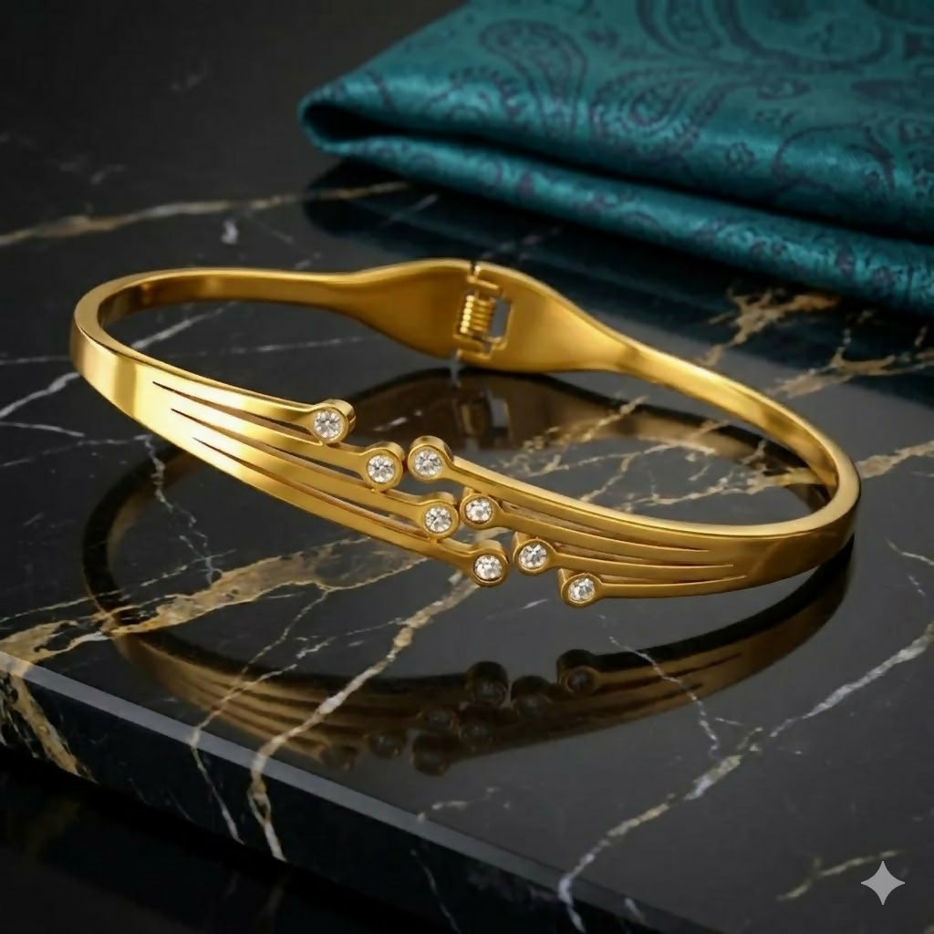 Close-up of floral gold-tone and enamel bracelet details