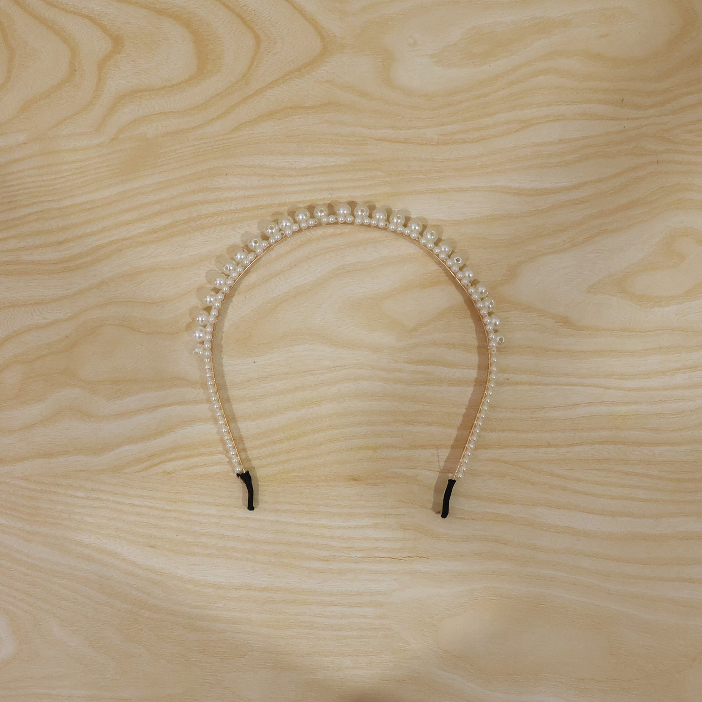 Pearl hairband worn by model