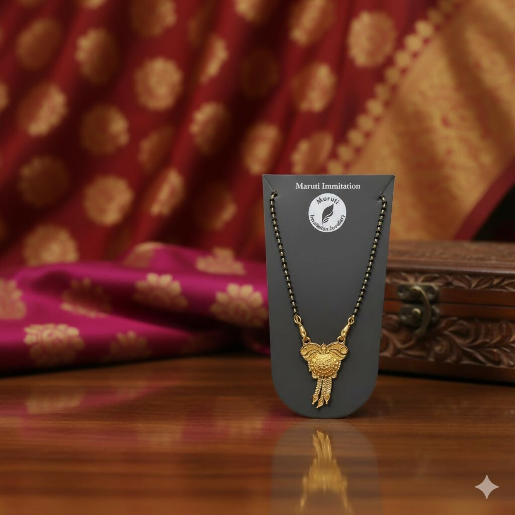 CZ-studded heart with a couple silhouette, this pendant is cast in gold-toned imitation metal to celebrate the sacred bond of marriage.