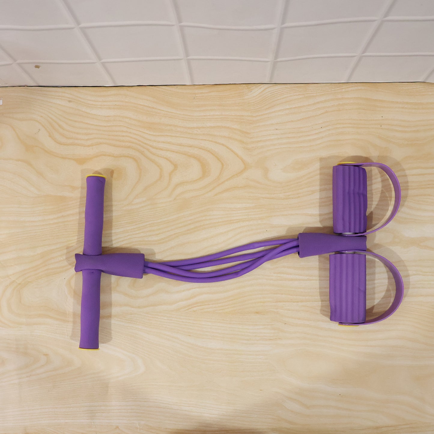 User demonstrating pull rope resistance exerciser