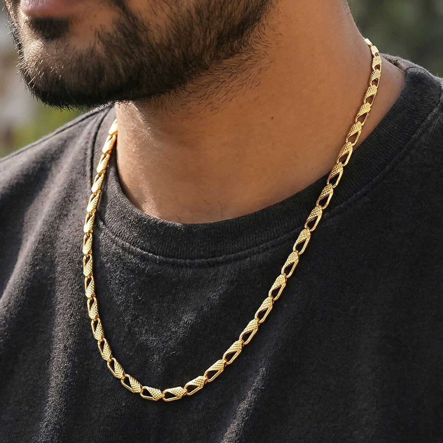 Gold and silver dual tone chain necklace laid out flat