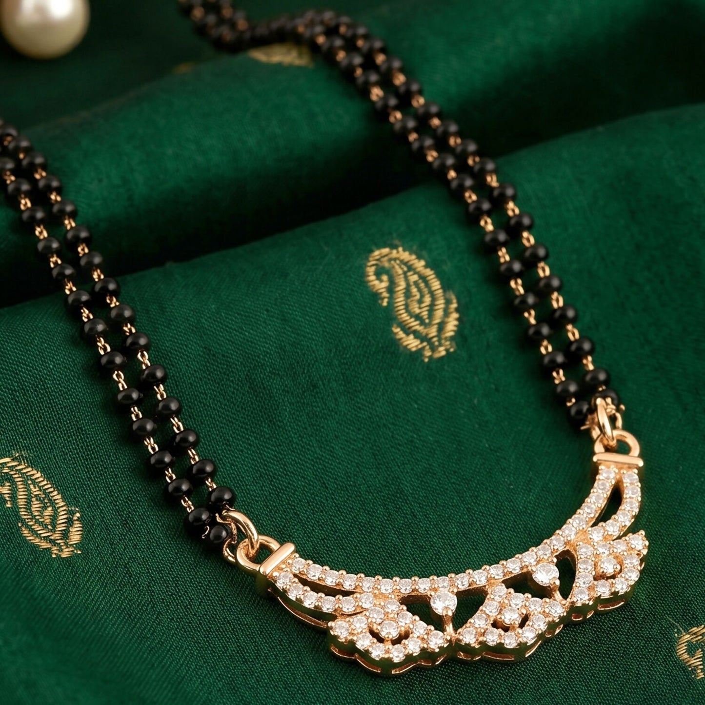 Fashionable mangalsutra with delicate floral CZ motifs and black beads
