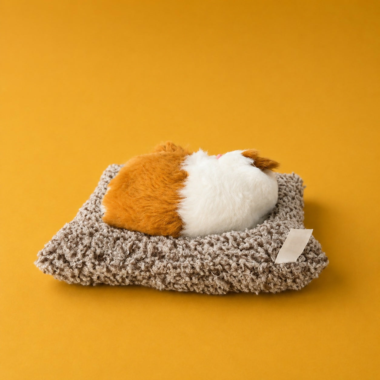 Soft sleeping cat plush toy showing realistic details
