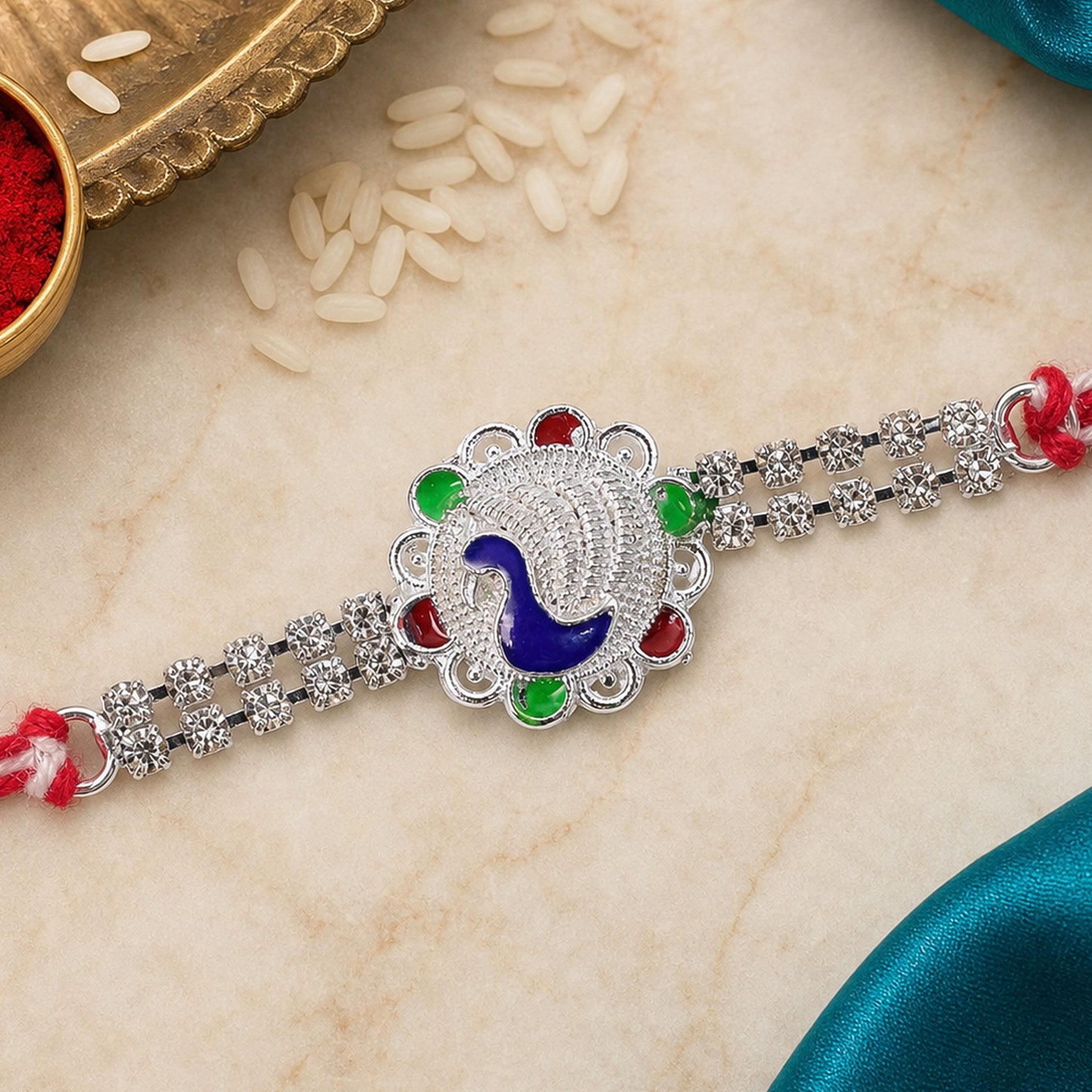 Classic Rakhi showcasing Paisley Swirl Charm, crystal sparkle and gift style for Gift