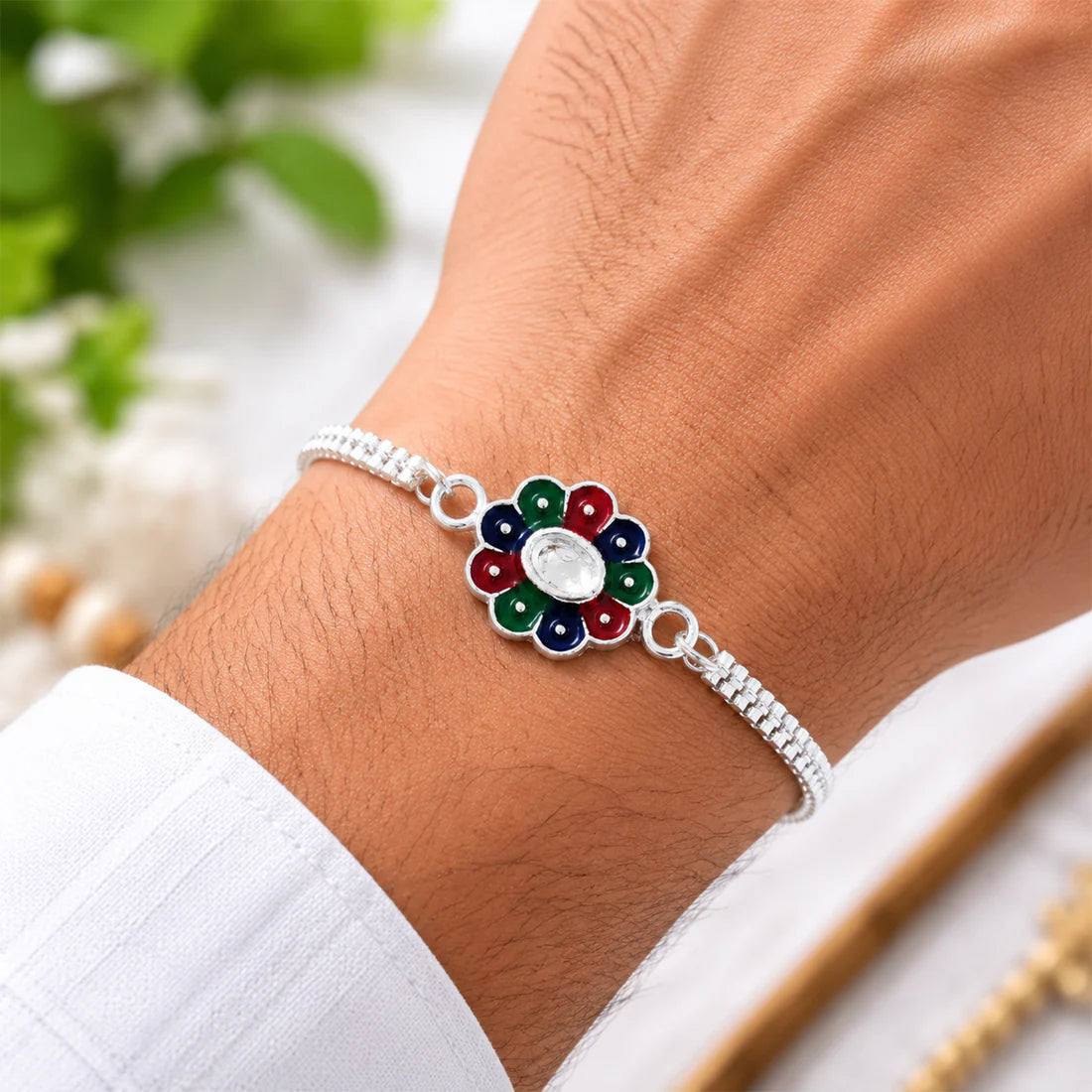Close up of Colorful Petal Rakhi showing intricate petal design and silver chain details.