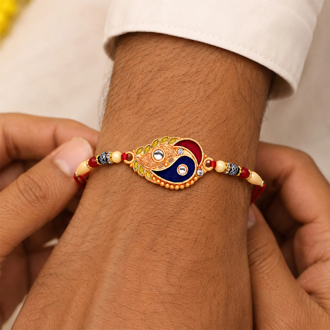 Elegant Enamel Rakhi, Paisley Design with Gold-Tone Embellishments