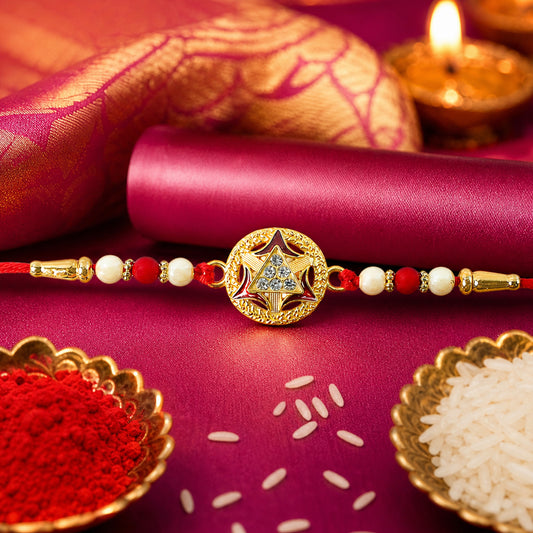 Golden Rakhi with traditional round design for brothers.