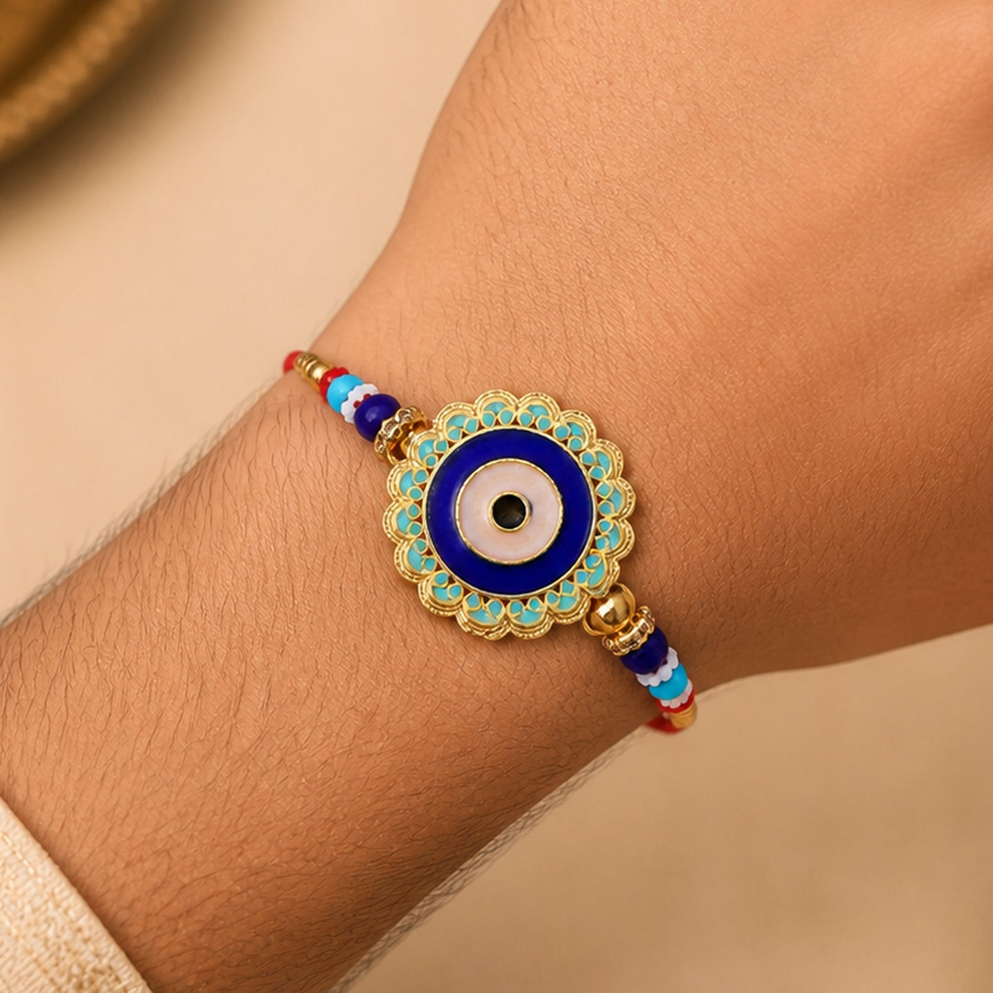 Evil Eye Rakhi – Stylish Beads with Golden Accents for Protection