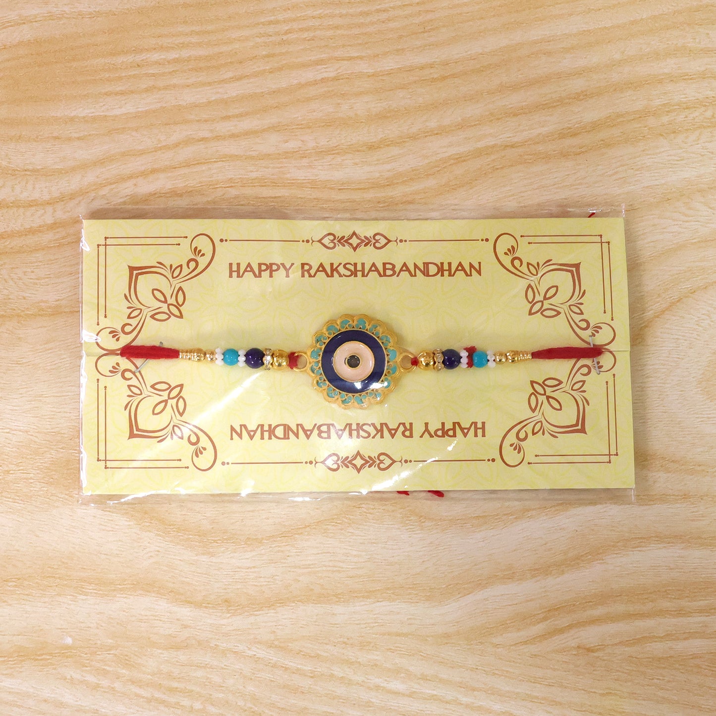 Evil Eye Rakhi – Stylish Beads with Golden Accents for Protection