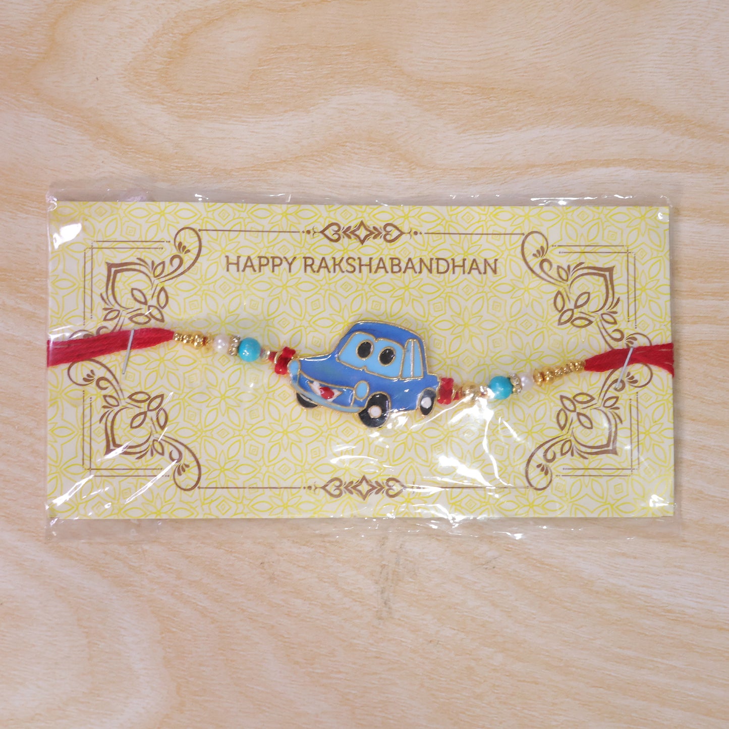 Kids Car Rakhi – Playful Design with Red Thread for Brothers