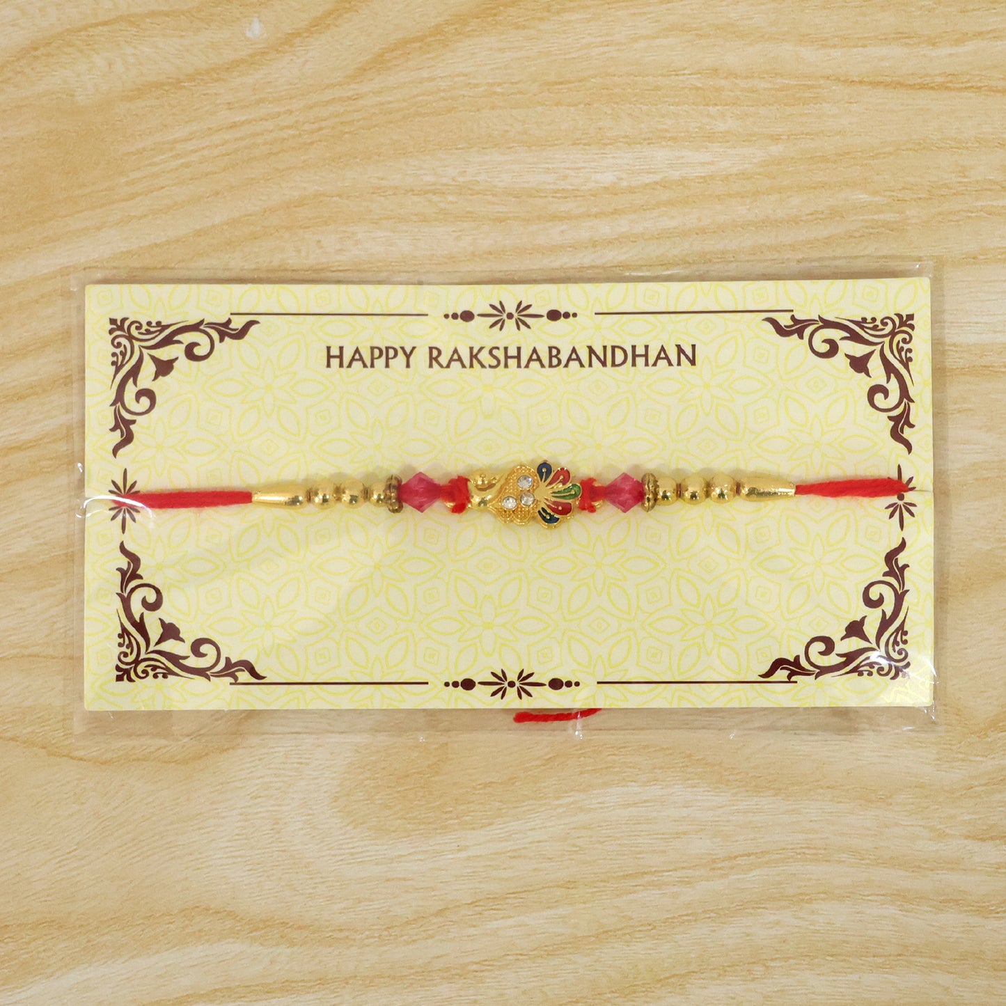 Golden Peacock Charm Rakhi for Brother
