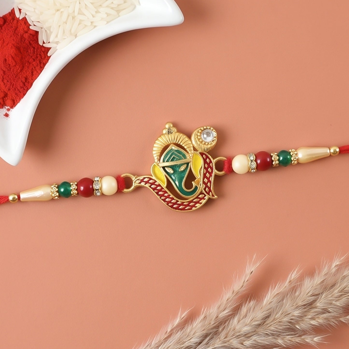 Top view of a Ganesha Rakhi showcasing its detailed craftsmanship.