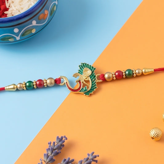 Om Peacock Feather Rakhi – Handcrafted Symbol of Protection