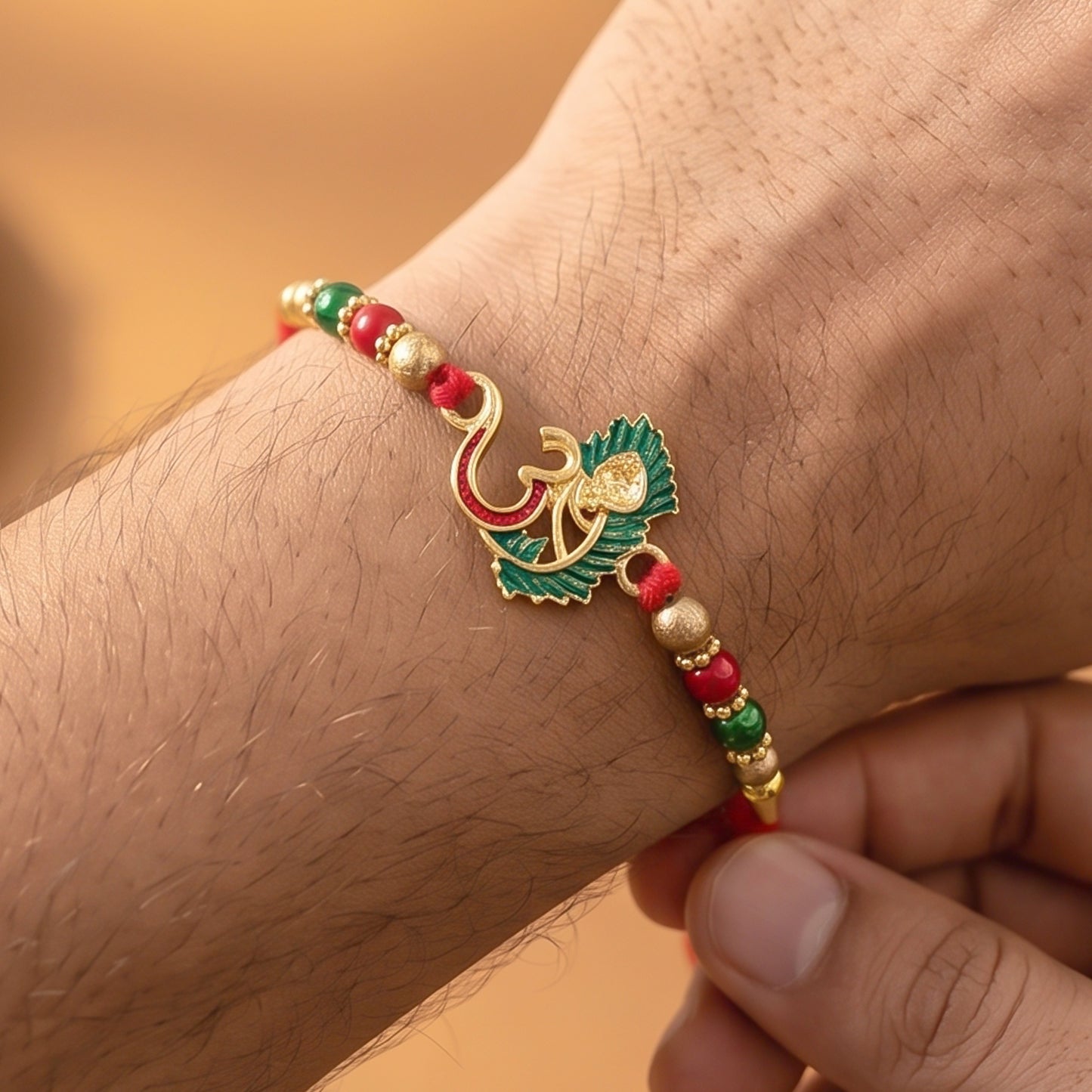 Traditional Om Rakhi with peacock feather tied on a brother's wrist during Raksha Bandhan.