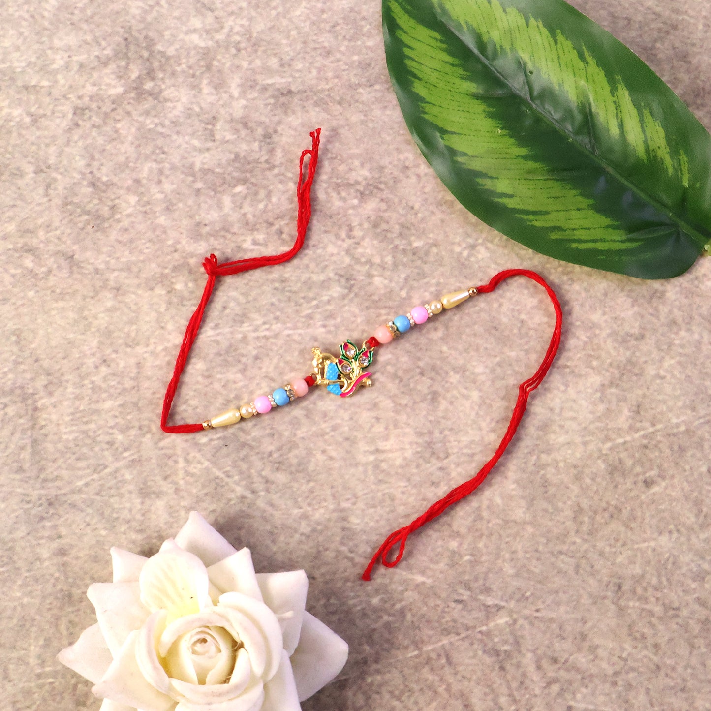 Traditional peacock design rakhi with festive colors