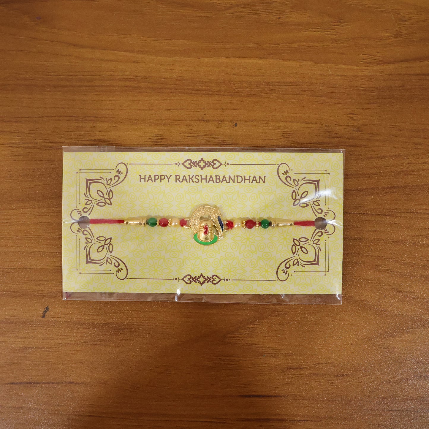 Traditional Designer Ganesha Rakhi in natural setting