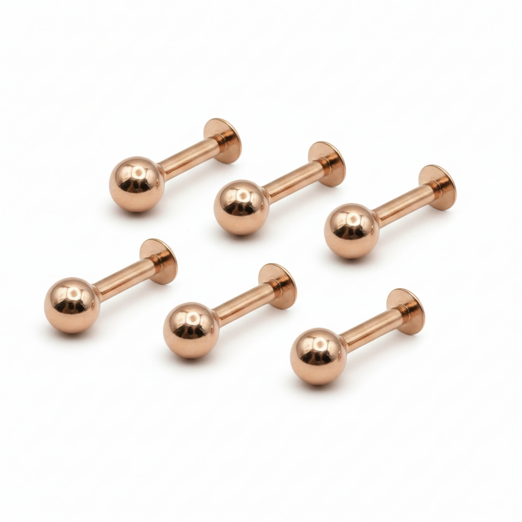 Rose gold plated labret studs featuring secure push-pin or internally threaded backs.