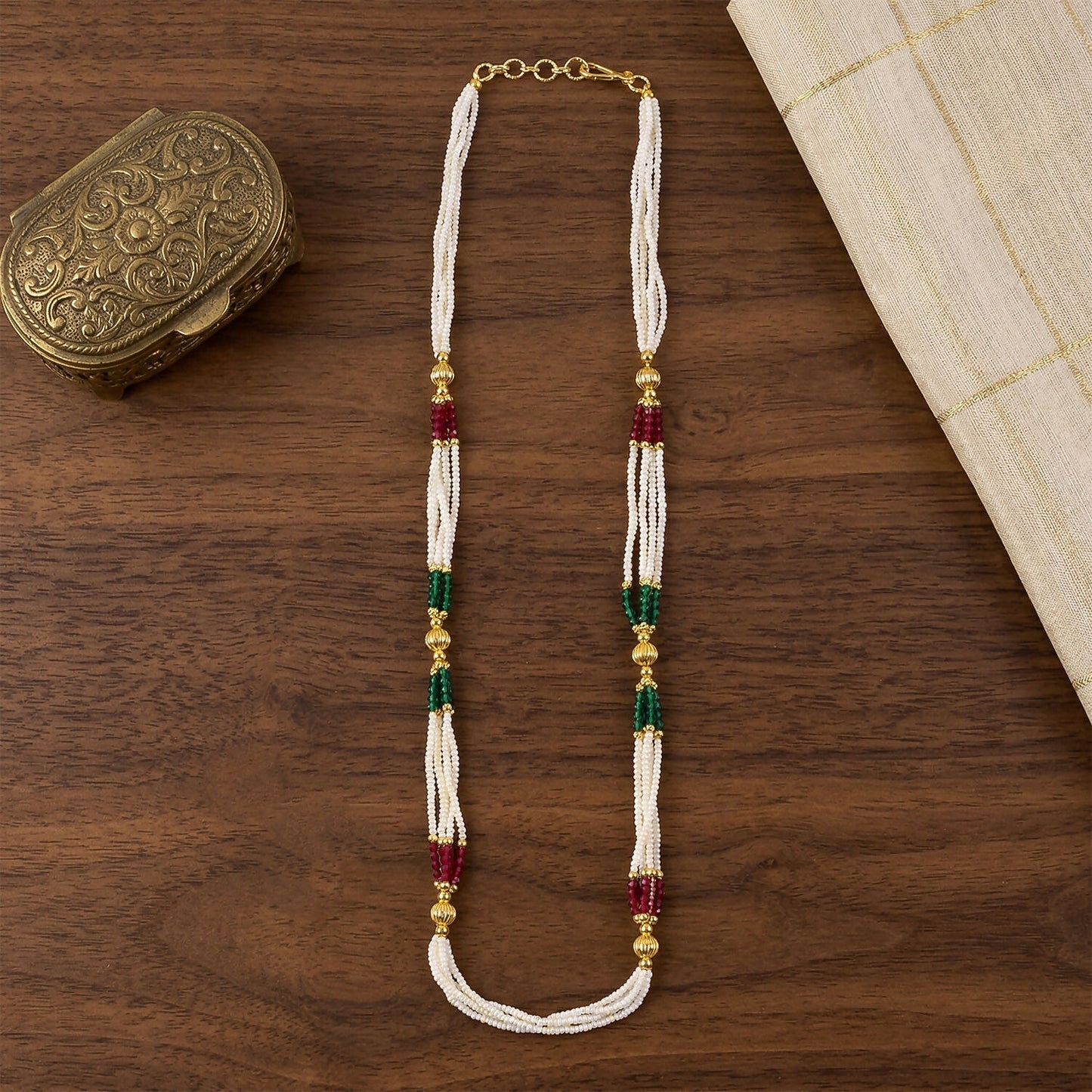 White beaded mala necklace worn with traditional outfit